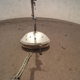 The Wind and Thermal Shield sitting atop InSight’s seismometer.